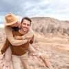 Happy couple on summer vacation in famous place. Cave formations.
